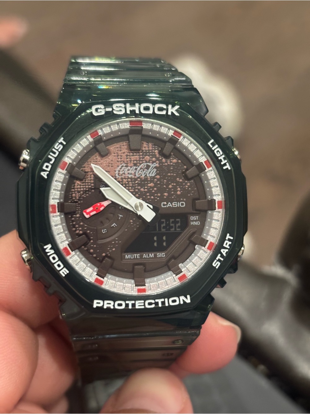 Casio G-SHOCK Coca Cola Green Resin Watch with Brown Dial and Red Accents